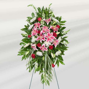 pink floral funeral tribute on easel